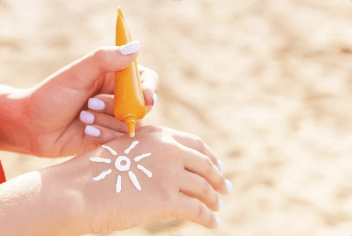 Sun Protection Before Treatment Applying SPF 30 sunscreen as part of pre-procedure skincare routine before aesthetic treatment