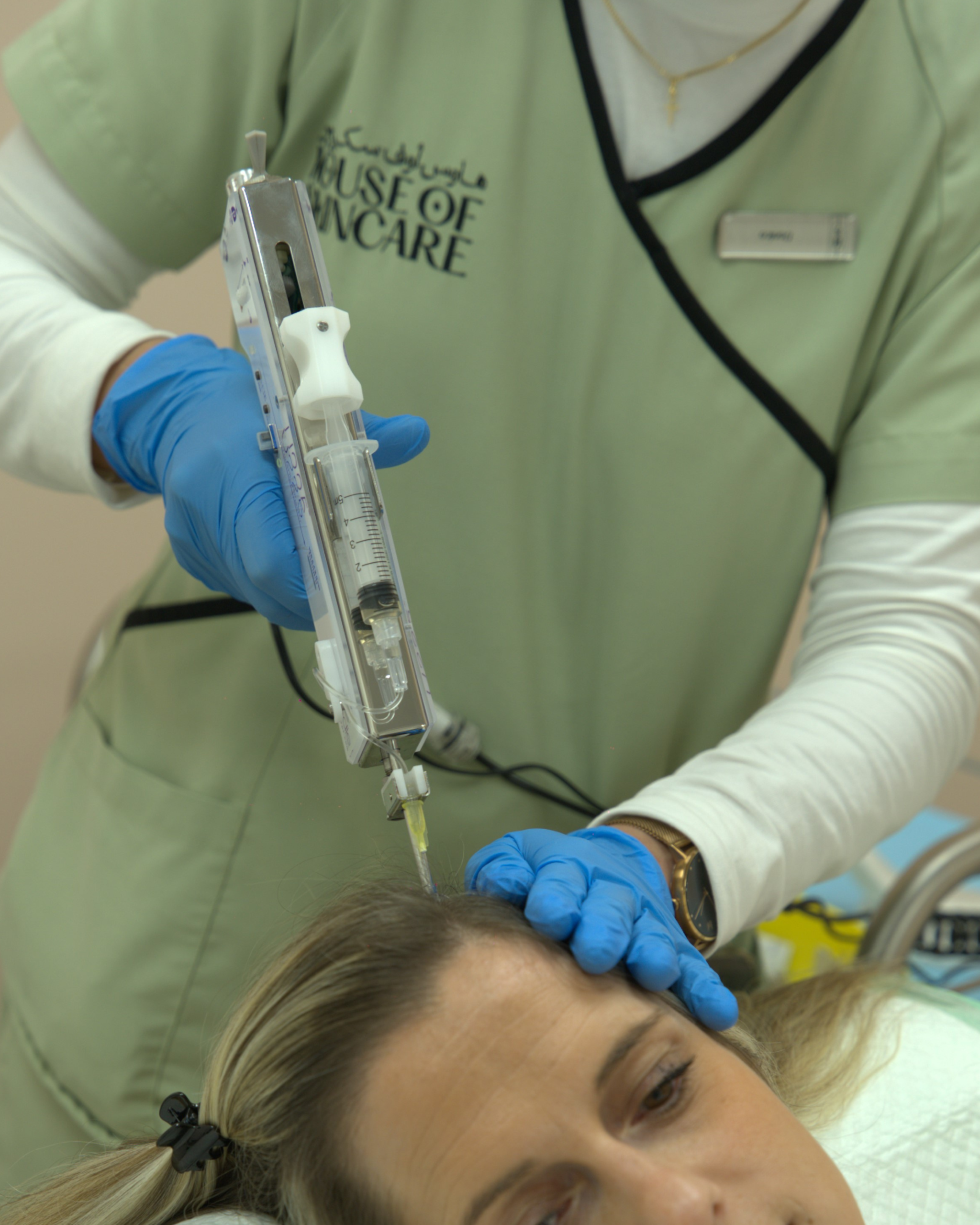 PRP for Hair Loss in Abu Dhabi: A Dermatologist's Guide Hair loss treatment session at House of Skincare Abu Dhabi showing scalp injection technique